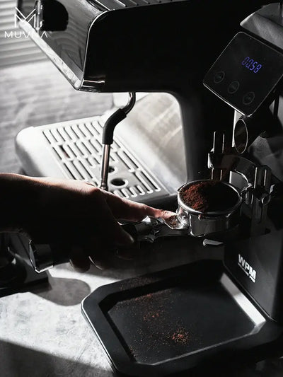 Muvna Lucifer Bottomless Portafilter brewing espresso at a UAE campsite