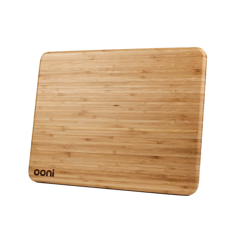 Ooni Pizza Prep Lid resting securely on top of dough boxes at a UAE desert campsite