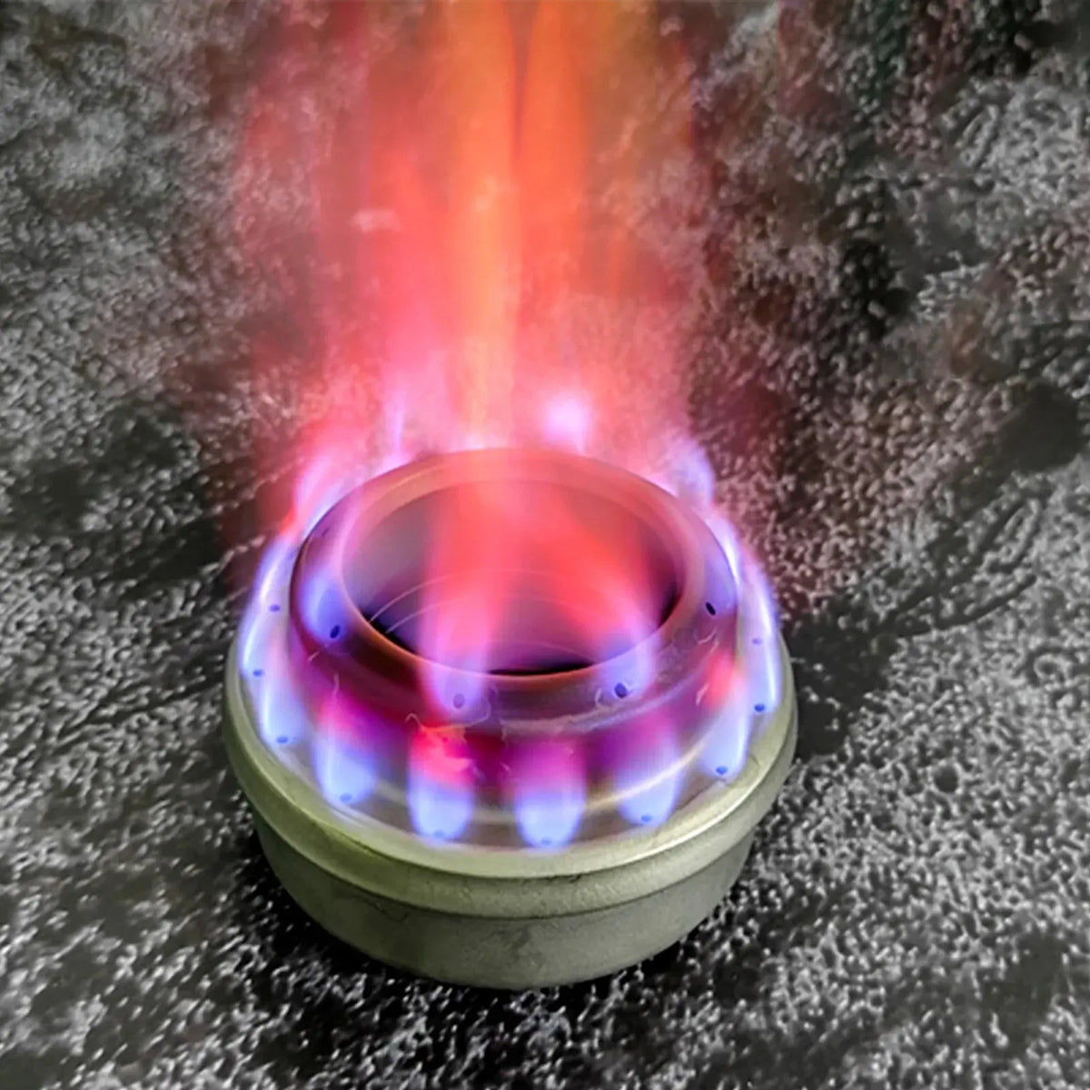 SilverAnt Ultralight Titanium Stove Cross Stand and Windshield with colorful flames in use