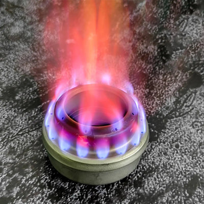 SilverAnt Ultralight Titanium Stove Cross Stand and Windshield with colorful flames in use