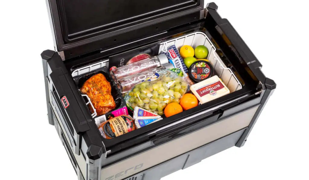 Open ARB Zero Portable Fridge Freezer Single Zone - 60L filled with food and drinks, perfect for outdoor adventures.