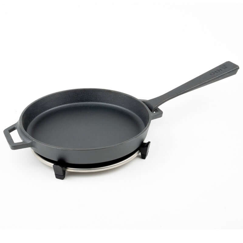 Ooni Cast Iron Skillet Pan for outdoor cooking, ideal for high-heat searing and roasting, shown on a white background.