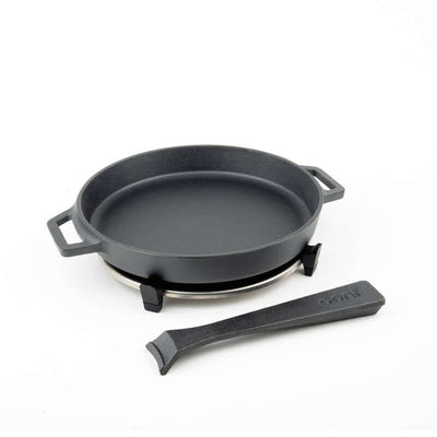 Ooni Cast Iron Skillet Pan for outdoor cooking with removable handle, ideal for searing steaks and roasting vegetables.