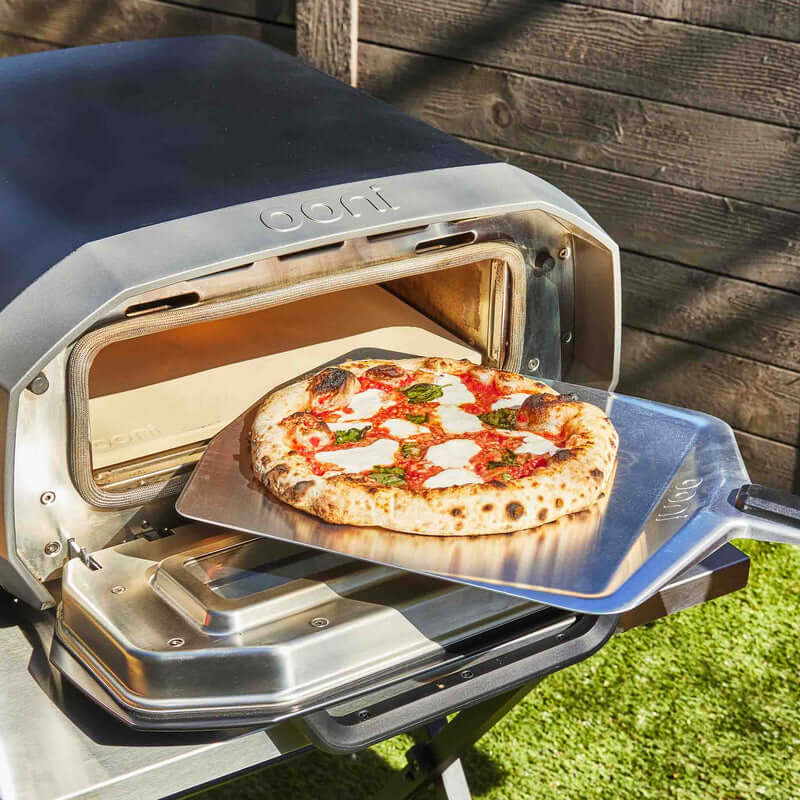 Launching dough into an oven with the Ooni Pizza Peel