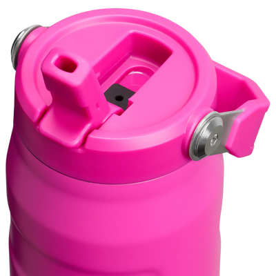 Stanley IceFlow Bottle with Flip Straw Lid in pink color, featuring a convenient flip straw and folding carry handle for easy use.