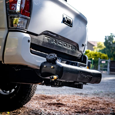 WaterPORT Hitch Mount Kit for 8 Gallon Weekender Tank attached to a truck, outdoor setting