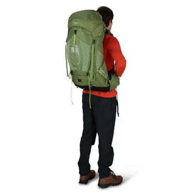 Man wearing Osprey Atmos AG 50 - Men backpack, showcasing AntiGravity suspension for comfort during multiday hiking trips.