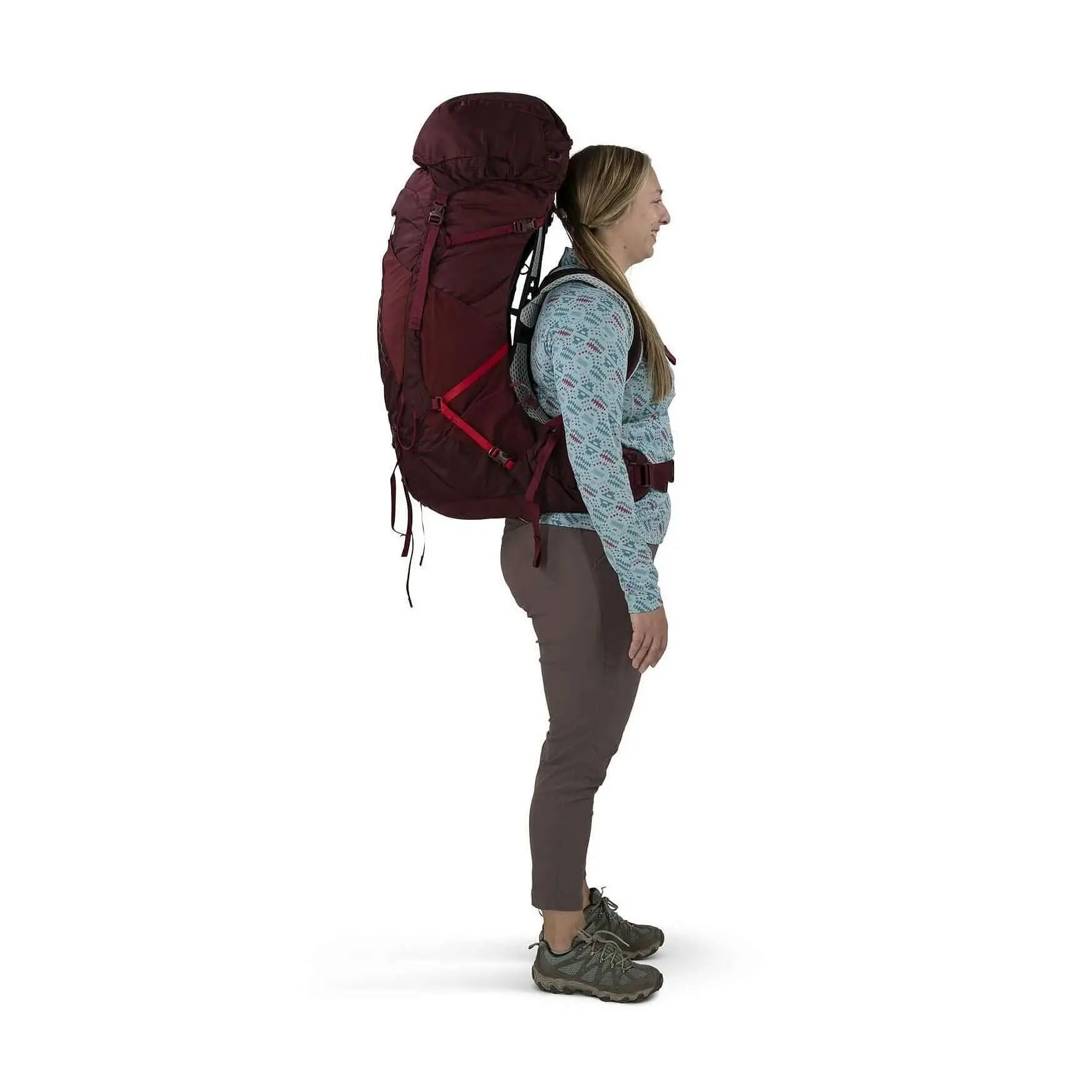 Woman wearing Osprey Aura AG LT 65 - Women backpack, showcasing its lightweight design and AntiGravity suspension for comfort.