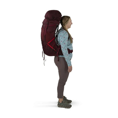 Woman wearing Osprey Aura AG LT 65 - Women backpack, showcasing its lightweight design and AntiGravity suspension for comfort.