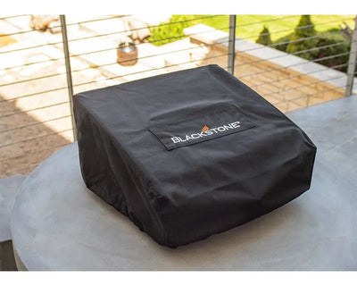 Blackstone Tabletop Griddle Cover and Carry Bag on a table, showcasing its durable design for 17 Inch griddle, perfect for outdoor adventures