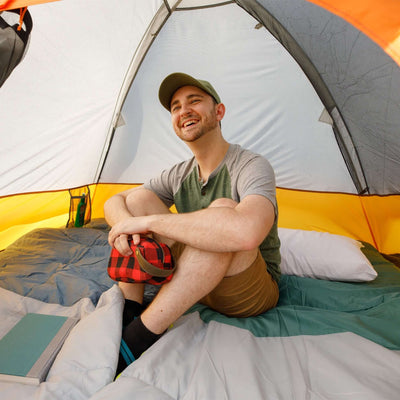 3 Person Dome Backpacking Tent - 7' x 7' interior view with a happy camper enjoying the spacious tent.