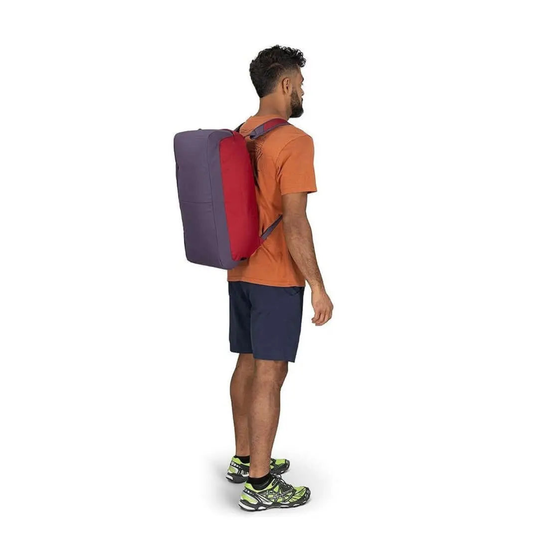 Osprey Daylite Duffel 30 in backpack mode shown on person, featuring versatile carry options and durable design for everyday use.