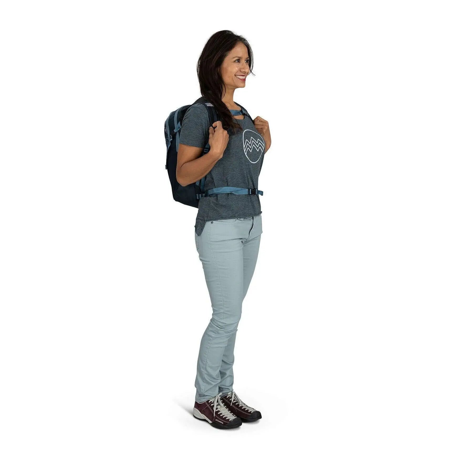 Woman wearing the Osprey Daylite backpack, showcasing its lightweight and versatile design for daily errands and outdoor activities.