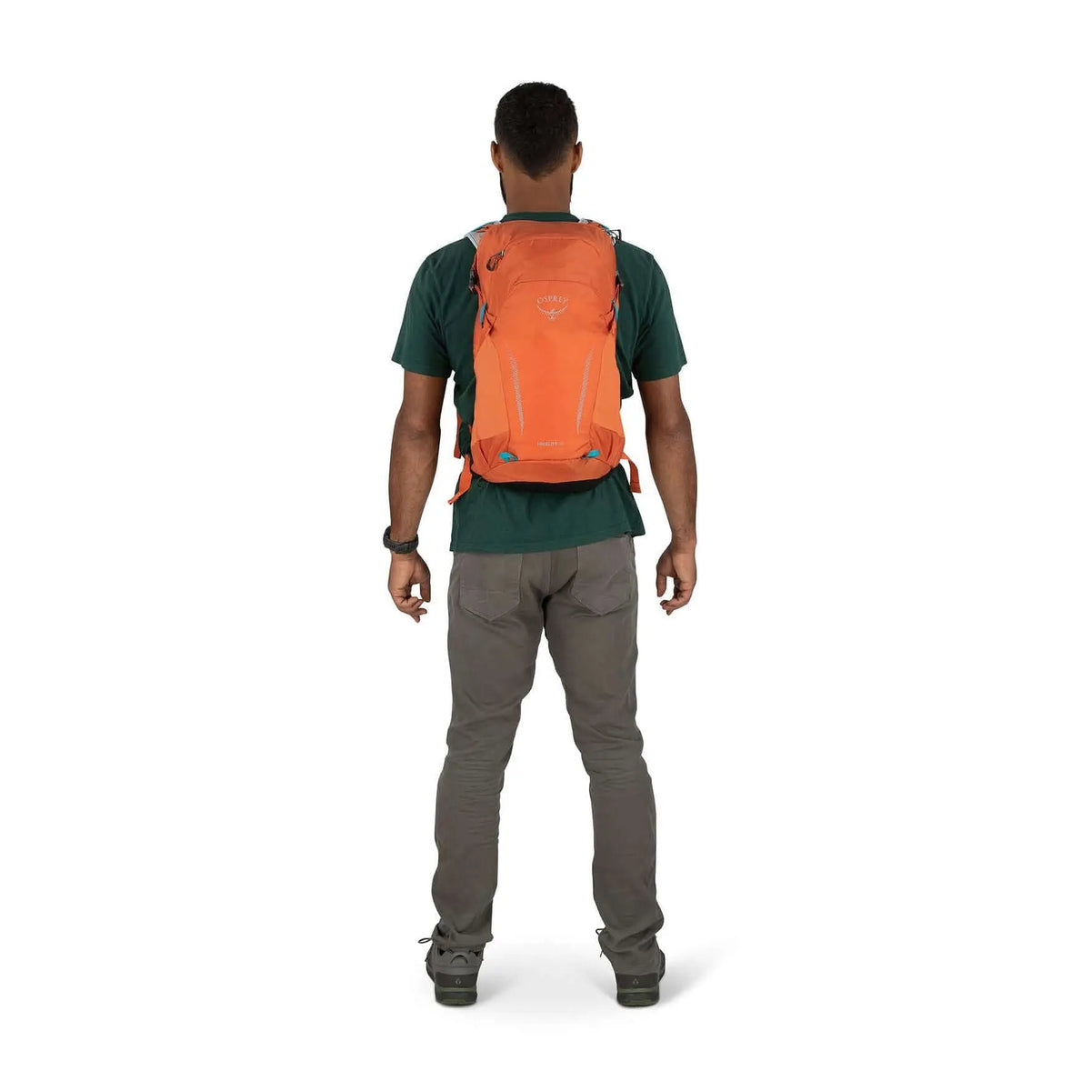 Man wearing Osprey Hikelite 18 daypack with AirSpeed ventilation, showcasing the lightweight and streamlined design ideal for hiking.