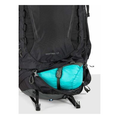 Osprey Kestrel 68 - Men backpack showing storage capacity with gear packed, ideal for rugged adventures and trail work.