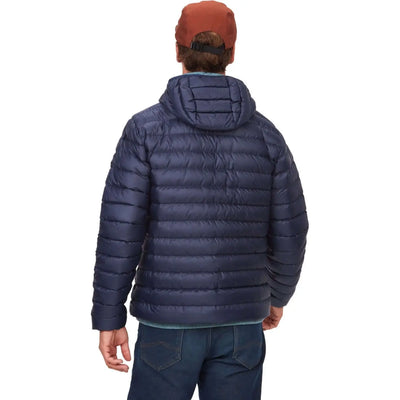 Back view of Marmot Highlander Jacket - Men, navy blue, with hood, worn by person outdoors. Ideal for cold weather adventures.