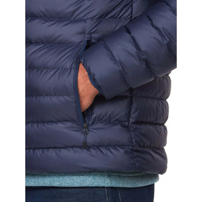 Close-up of Marmot Highlander Jacket - Men in blue, showing zipper pocket and quilted texture for outdoor adventures.