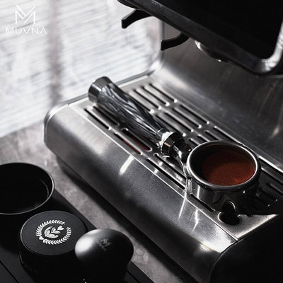 Ergonomic black handle on the Muvna Lucifer Bottomless Portafilter