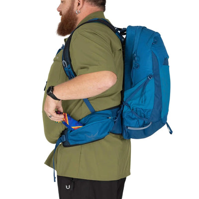 Man wearing the Osprey Talon 22 Extended Fit - Men backpack, showcasing hipbelt and harness features.