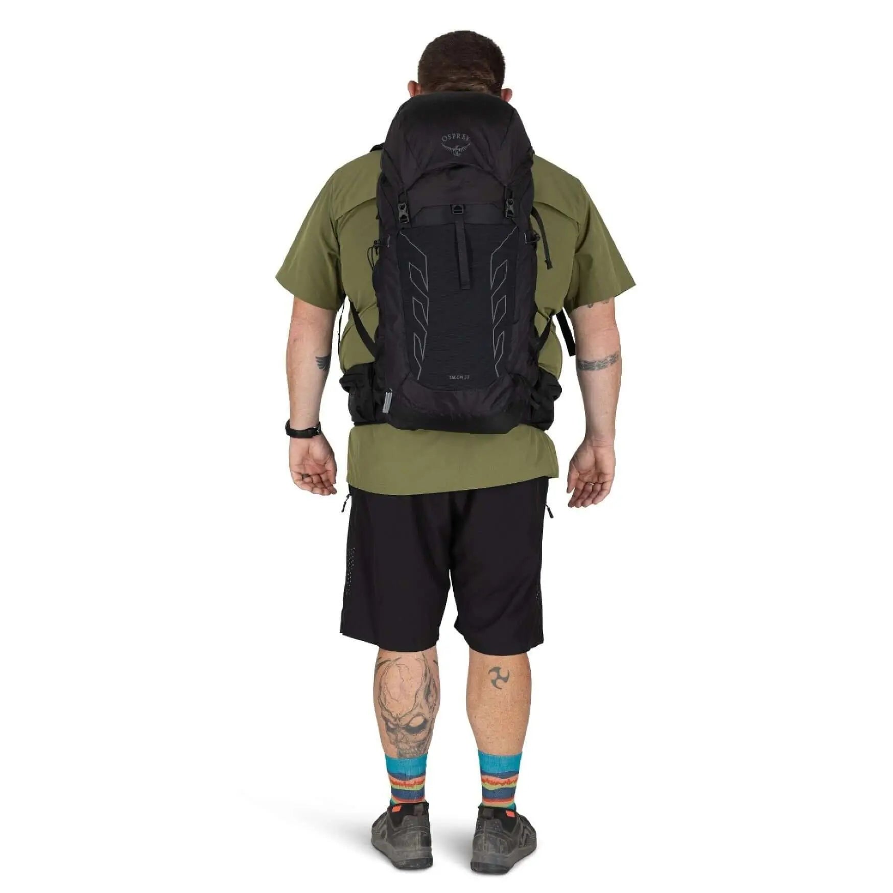 Men's Osprey Talon 33 Extended Fit travel daypack with hiking poles attached to the side.