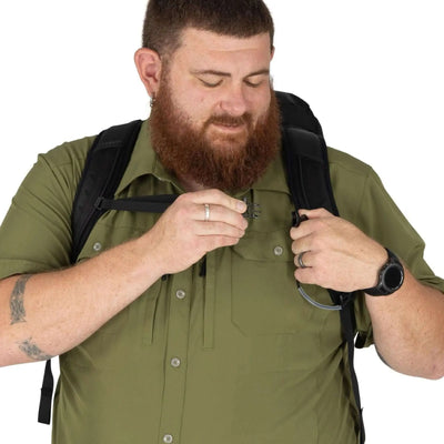 Man adjusting Osprey Talon 33 Extended Fit daypack strap