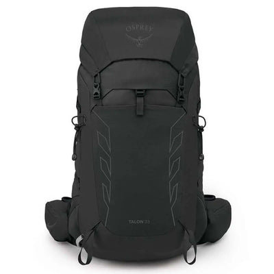 Front view of the Osprey Talon 33 Extended Fit men's daypack in the outdoors.