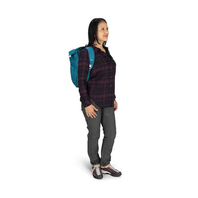 Woman wearing Osprey Poco Changing Tote backpack-style, ideal for parenting on the go with comfort and convenience.