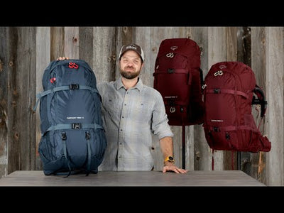 Fairview Trek 70 - Women displayed by a model with colorful backpacks in the background, perfect for travel and adventure.