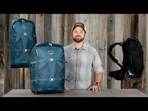 Farpoint Wheeled Travel Carry-On 36L/21.5" - Men by Osprey displayed with a male model in front of wooden background.