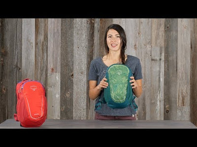 Woman displaying Osprey Daylite Jr. - Kids backpack with ventilated backpanel and mesh pockets.