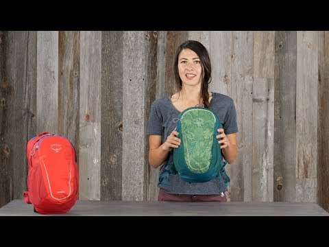 Woman displaying Osprey Daylite Jr. - Kids backpack with ventilated backpanel and mesh pockets.