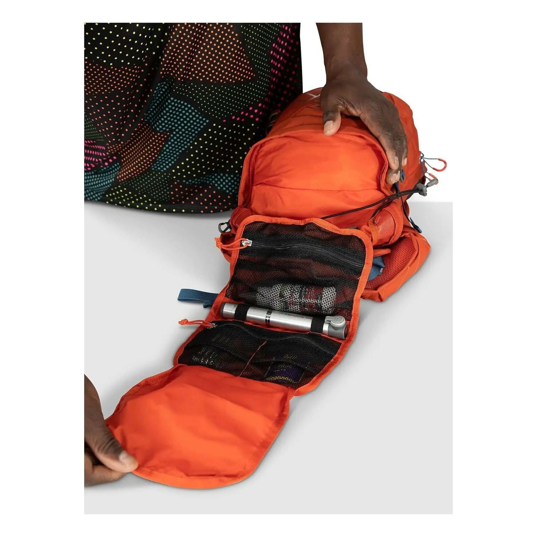 Osprey Raptor 10 mountain biking pack with Hydraulics reservoir, open view showing compartments. Ideal for climbs and descents.