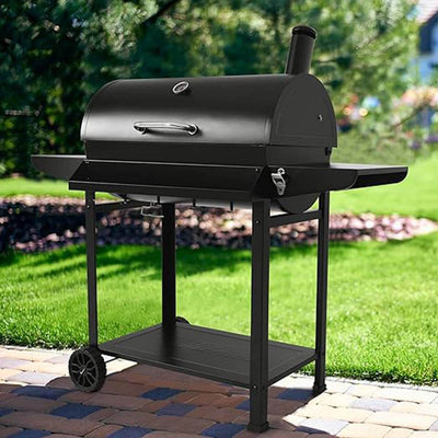Royal Gourmet 28-Inch Barrel Charcoal Grill with Front Basket in UAE Backyard