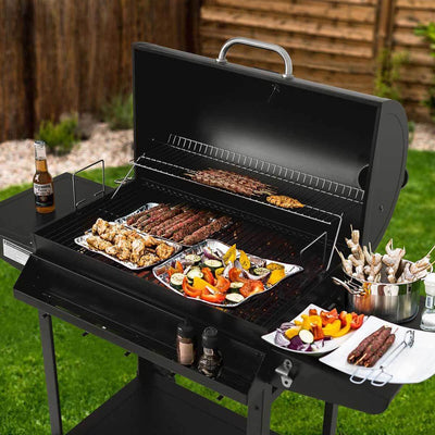 Royal Gourmet 28-Inch Barrel Charcoal Grill with Front Basket with food