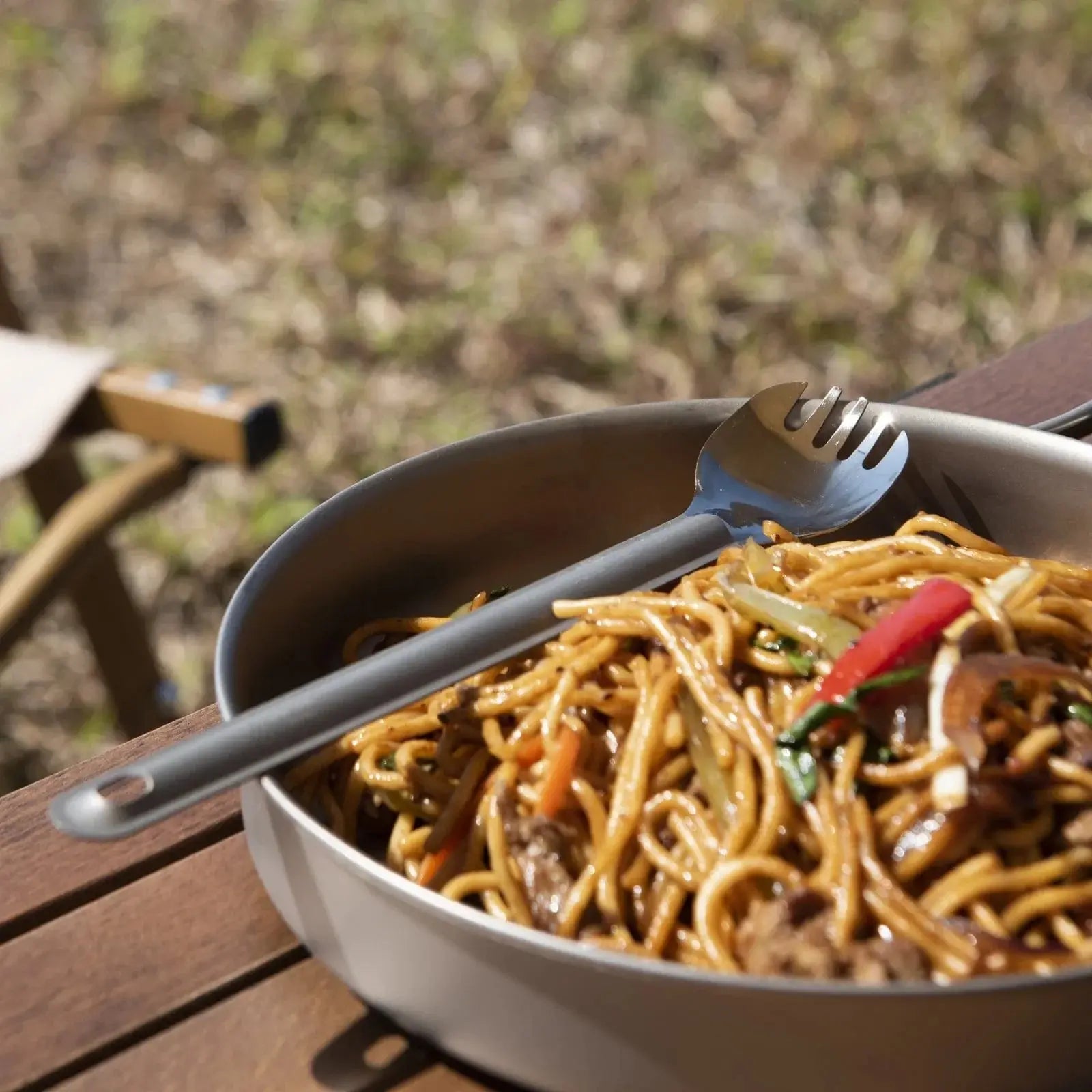 SilverAnt Long Handle Titanium Spork with noodles in camping setting