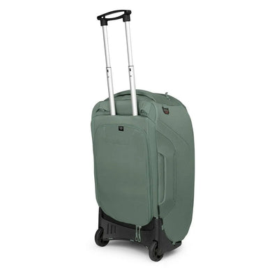 Osprey Sojourn Shuttle Wheeled Duffel 25"/60L in green with oversized wheels and lightweight chassis. Perfect travel bag with compression straps.