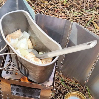 Cooking with SilverAnt Long Handle Titanium Spork in outdoor camp kitchen setup