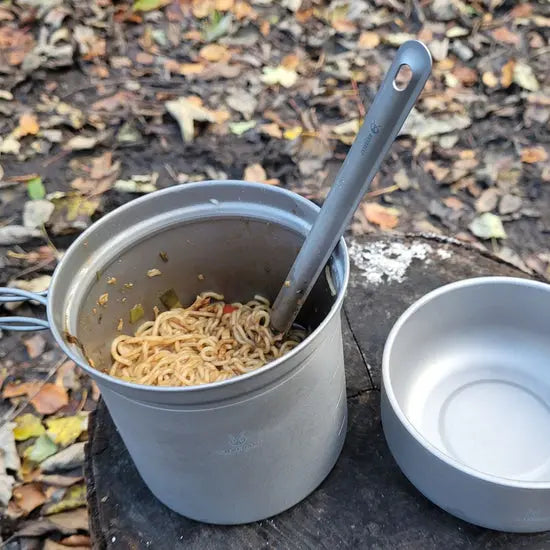 SilverAnt Long Handle Titanium Spork in use with large pot, perfect for camping