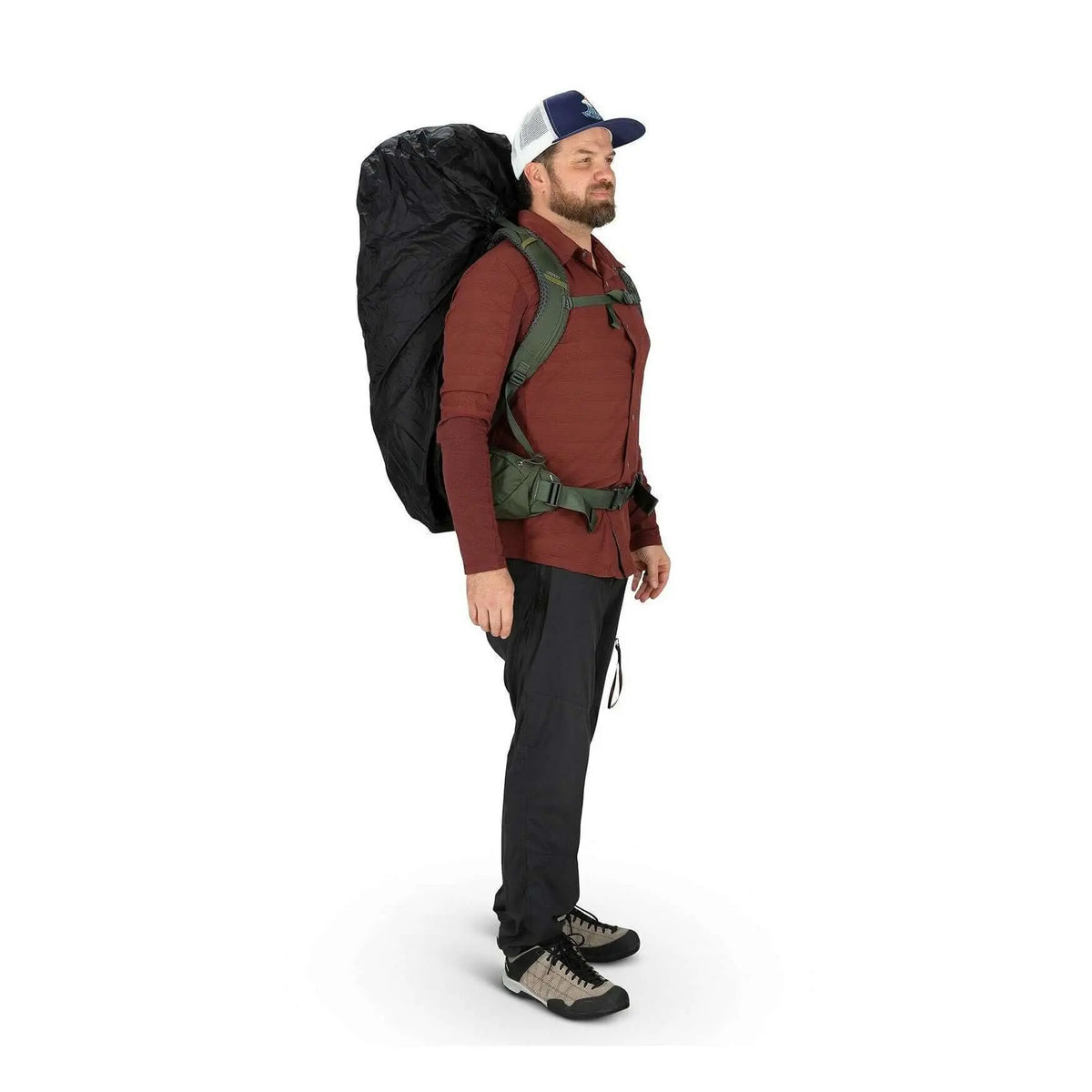 Man wearing a backpack with an Ultralight Raincover for outdoor protection, showcasing durable waterproof design.